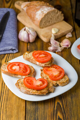 toast in olive oil spread with garlic and  tomato