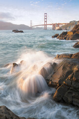 Golden Gate Bridge during sunset with crashing waves, new San Fransisco, California, USA
The Golden Gate Bridge is the most famous attraction.
Traveling concept background.