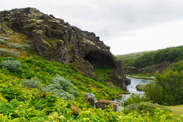 Fototapeta na wymiar Rock Formation in Gjain Valley in Spring in the Highlands of Iceland