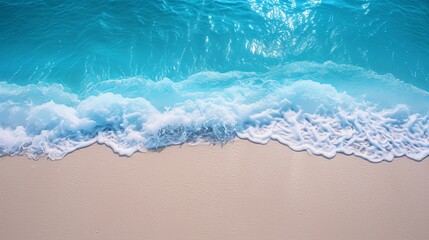 Fototapeta na wymiar Soft wave of blue ocean on sandy beach