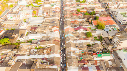 Aerial view, drone flying over Phuket city, Thailand. Drone over SinoPortugyese It's a Sunday in Phuket and tourists go shopping on the old streets filled with local merchants selling food and clothes