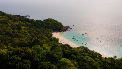 Paradise beach Phuket Patong. aerial top view amazing freedom beach small white sand beach with perfect nature. white wave hit the rock around island. green forest peaceful. green sea, landscape.