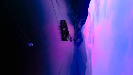Beautiful pink sunset on lake maggiore in Italy. Vertical video from a drone. Isole Borromee. Isola Bella. Isola dei Pescatori Isola Superiore
