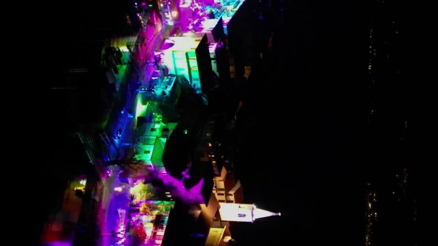 Night drone video of an island decorated for Christmas. Video verticale. Isola Superiore, Lago Maggiore, Piemonte, Italy