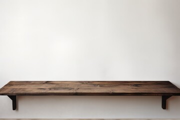 Empty wooden charcoal table over white wall background