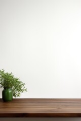 Empty wooden forest green table over white wall background 