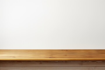 Empty wooden gold table over white wall background