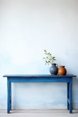 Empty wooden indigo table over white wall background