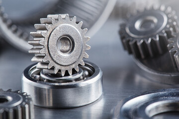 Obraz premium metal gears and bearings. Background with part of the mechanism.