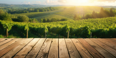 Empty wood table with blurred vineyard landscape background,  template display for montage products. Front view wooden table, green field, sunny day.  