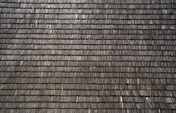 Abstract background image of weathered wooden tiles on the roof	