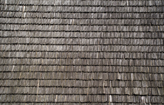 Abstract background image of weathered wooden tiles on the roof