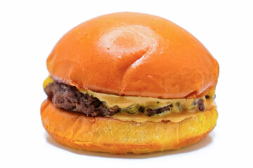 Burger beef cheese classic minimal close up isolated on white. Hamburger freshly baked on white plate, homemade. Grocery product advertising, menu or package.