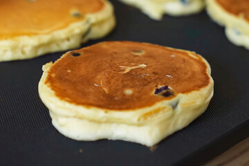 Pancakes fluffy delicious food. Homemade freshly baked pancakes for American breakfast, menu, advert or package, close up.