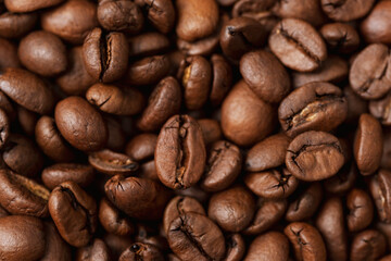 Roasted coffee beans texture, background. Macro photography, closeup