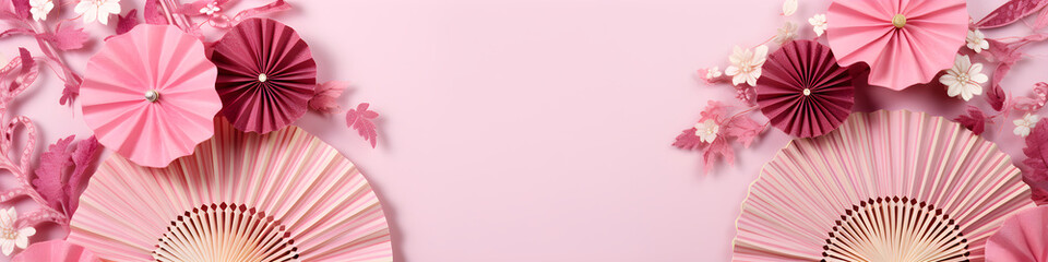 Festival paper fans and blossom flowers on pink background. Happy Chinese New Year. Spring floral banner in traditional japanese style