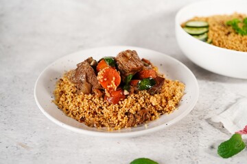 Homemade Moroccan Lamb tgine  or Tajine served with couscous