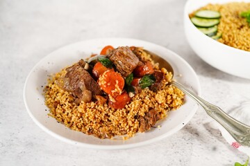 Homemade Moroccan Lamb tgine  or Tajine served with couscous