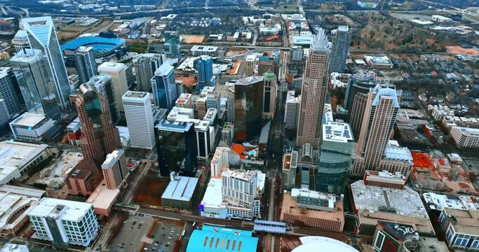 Ensemble of high-rise buildings in the architecture of Charlotte, NC downtown. Drone footage above the city at daytime.