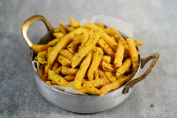 Methi Para - Indian savory snacks with fenugreek leaves and chickpea flour, selective focus