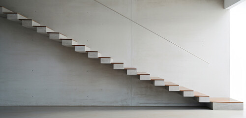 A minimalist staircase with thin concrete treads and a simple, yet elegant metal handrail.