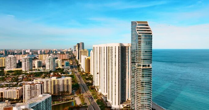 Approaching high-rise architecture on the shore of the Atlantic Ocean. View of Miami Beach, Florida, USA from top.