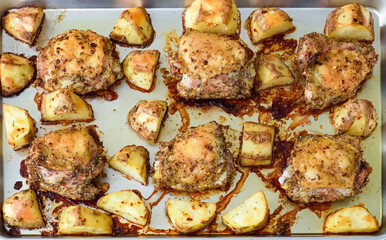 Healthy fresh meal on baking tray, vegetables, chicken. Homemade delicious lunch with chicken, potatoes, for restaurant, menu, advert or package, close up selective focus