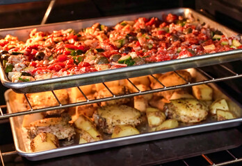 Healthy fresh meal on baking tray, vegetables, chicken. Homemade delicious lunch with chicken, potatoes, for restaurant, menu, advert or package, close up selective focus
