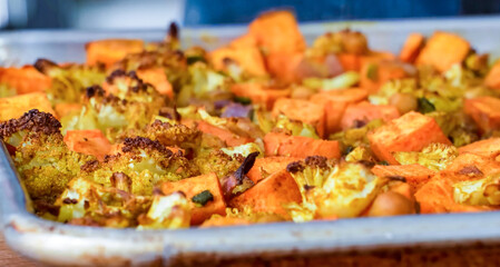 Healthy fresh meal, baked vegetables. Homemade delicious lunch with carrot, cauliflower for restaurant, menu, advert or package, close up selective focus