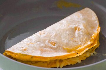 Healthy vegetarian breakfast, pita bread with omelette and vegetables. Vegan meal for restaurant, menu, advert or package, close up, selective focus