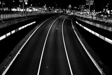 Black and white motorway curve at night minimalist