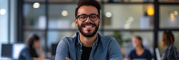 Smiling Man With Glasses Looking at the Camera - obrazy, fototapety, plakaty