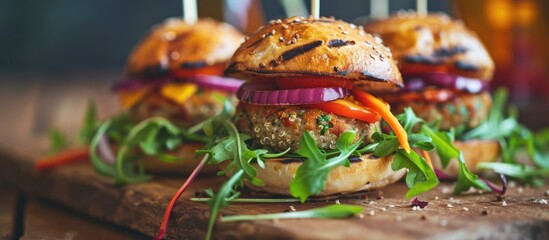 Red green black mini burgers with quinoa and vegetables. Copy space image. Place for adding text