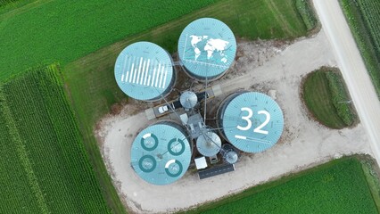 Agritech concept of grain silos with digital overlays for IOT and autonomous precision agriculture. Graphic, aerial © TechAnimationStock
