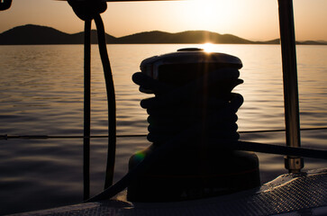 Winch on the sailboat during the  beautiful calm sunrise