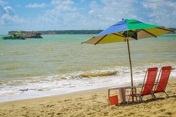 beach chairs and umbrella