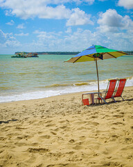 beach with umbrella and boats