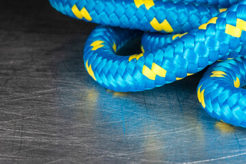 Close-up of blue rope on grunge steel surface
