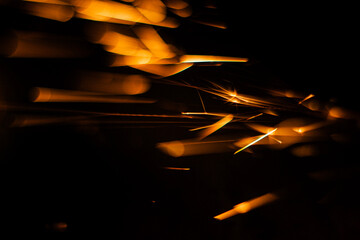fast flying sparks from an angle grinder, smeared and blurry
