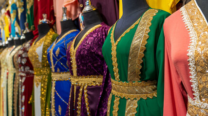 arabic women dress koftan for sale at a textile store in the souq faleh. - obrazy, fototapety, plakaty