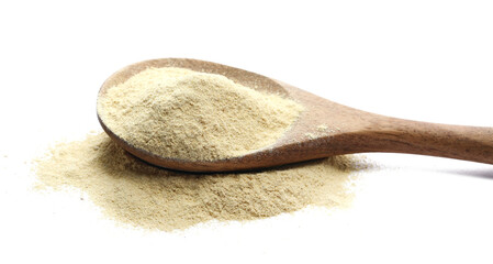 Ashwagandha powder pile in wooden spoon (Withania somnifera) isolated on white