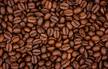 Close-up of roasted coffee beans for background, top view