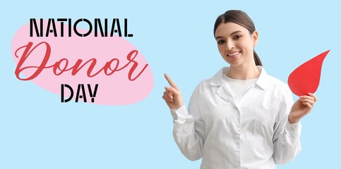 Awareness banner for National Donor Day with female doctor holding paper blood drop