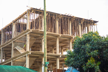 house construction in Tanzania using sticks and cement