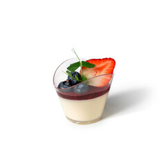Delicious panna cotta mousse pudding with berries in glass cup on white background. Candy bar, sweets and dessert, selective focus