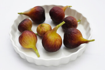 Fresh figs on white background.