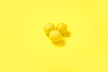 Chewing gums on yellow background