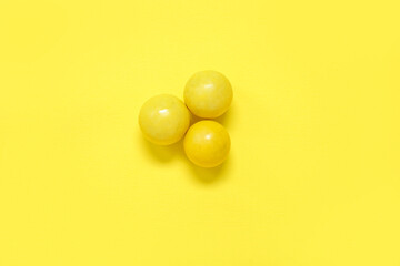 Chewing gums on yellow background