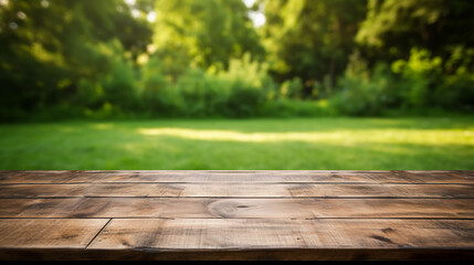 Empty wooden table on the background of spring greenery
