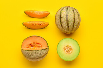 Tasty ripe melons on yellow background